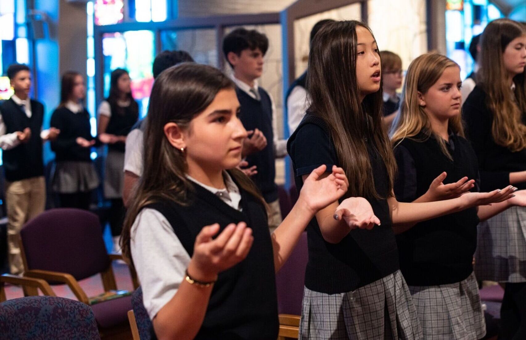 Students worshiping during mass